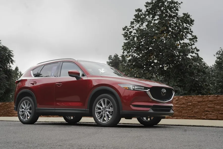 Red Mazda CX-5 parked by the road
