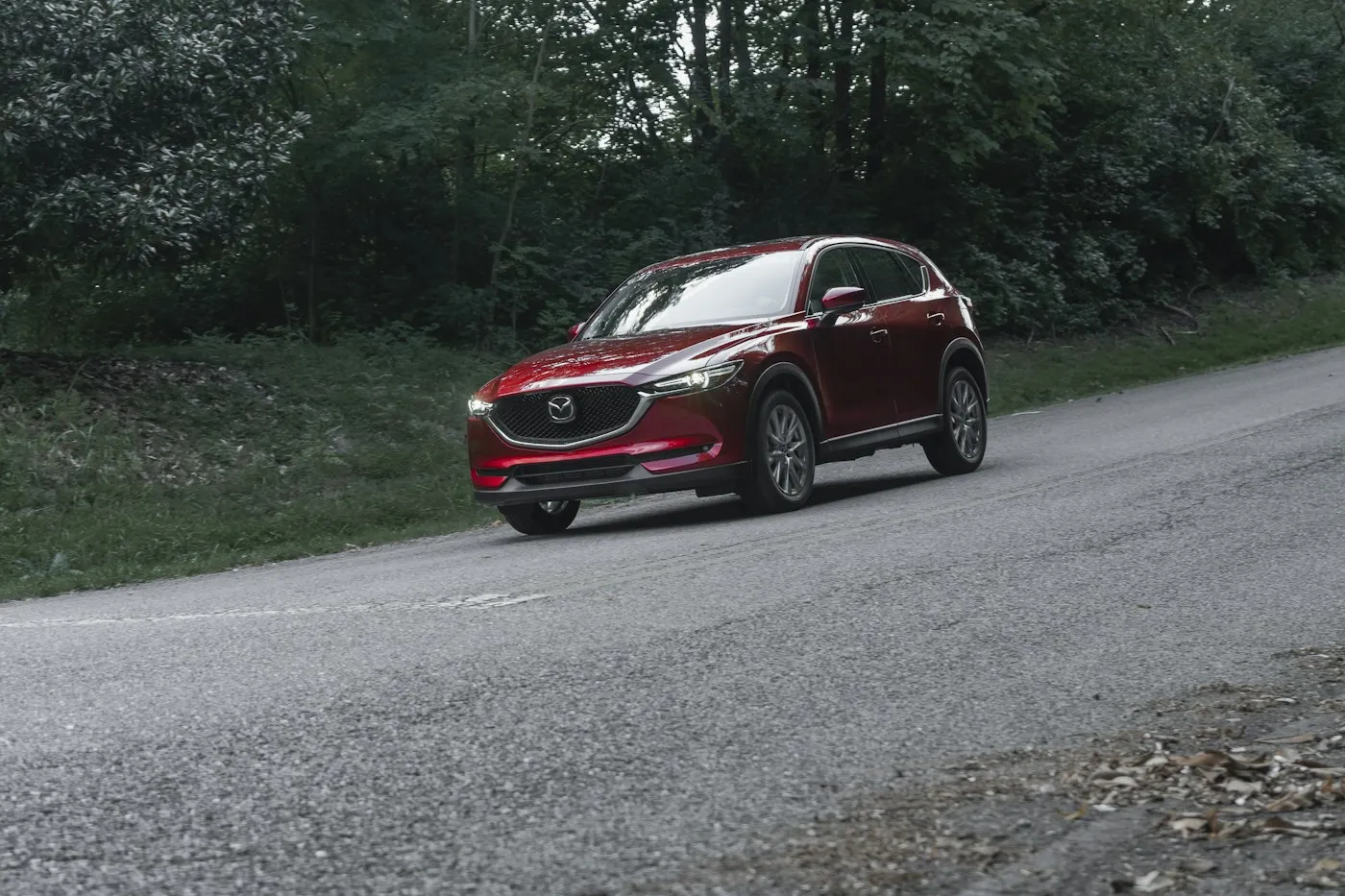 Red Mazda CX-5 on a country road